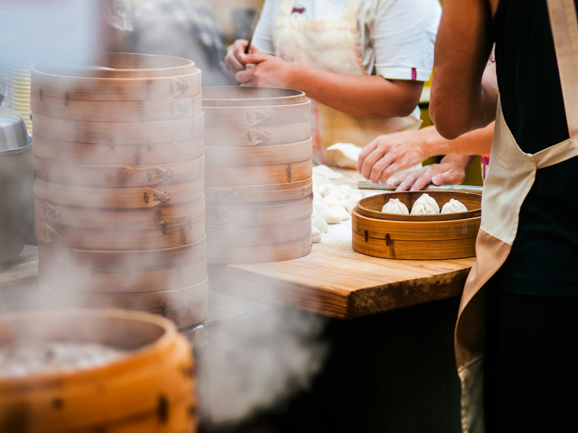 People making xiaolongbao dumplings in Shanghai © PixHound/ Shutterstock