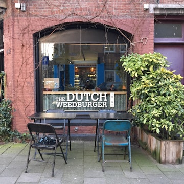 The exterior of The Dutch Weed Burger Joint restaurant in Amsterdam, The Netherlands © Claire Bissell / Lonely Planet