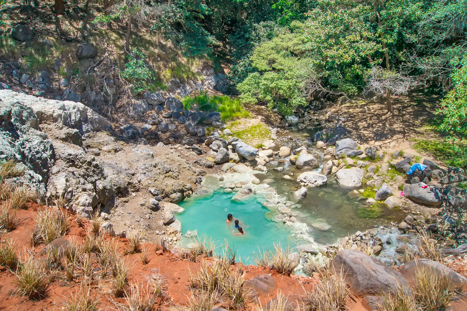 A couple takes a dip in the natural hot springs in Rincón de la Vieja in Costa Rica.