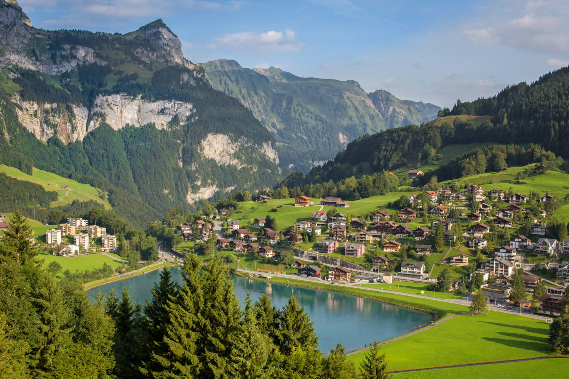 The beautiful lake and green hills of Engelberg village in Switzerland as seen from high above © Sizhe_Hu/Shutterstock