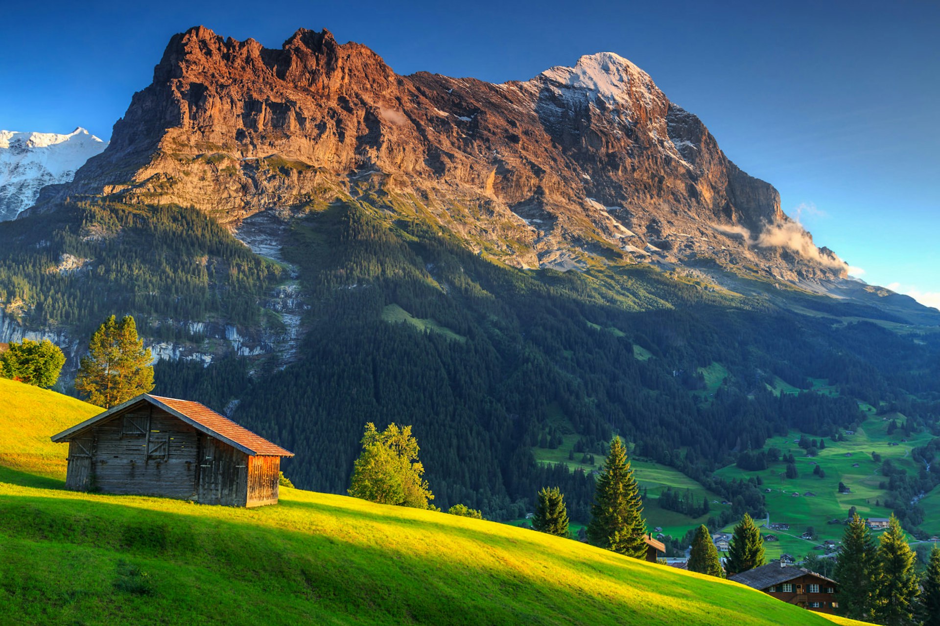 A mountain hut under the shadow of the Eiger mountain in Switzerland © Gaspar Janos / Shutterstock