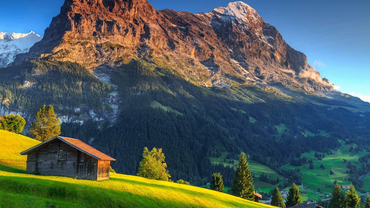 A mountain hut under the shadow of the Eiger mountain in Switzerland © Gaspar Janos / Shutterstock