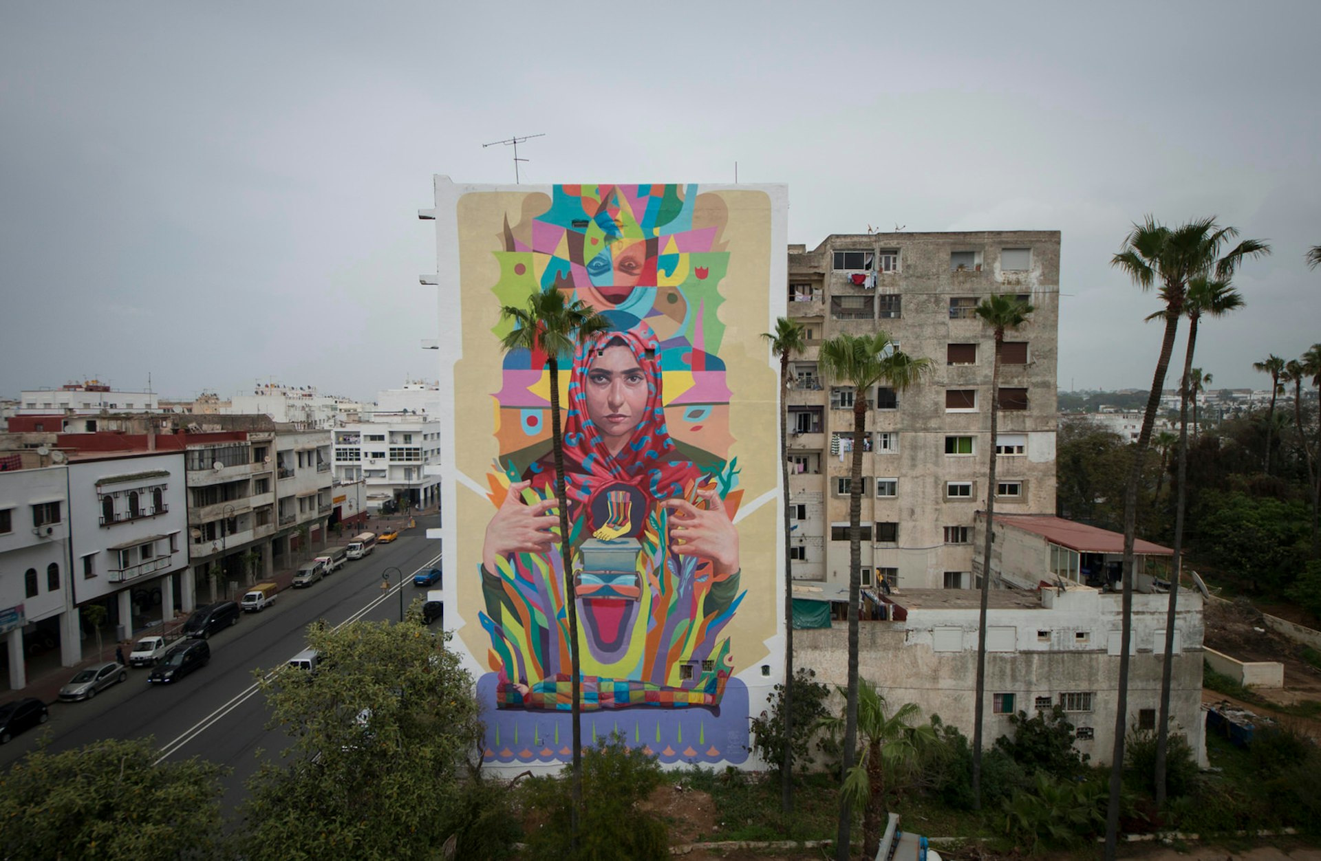 Building-high mural titled The step that transcends time is the collective step' by street artist Decertor in Rabat, Morocco © Walid Ben Brahim / JIDAR2018