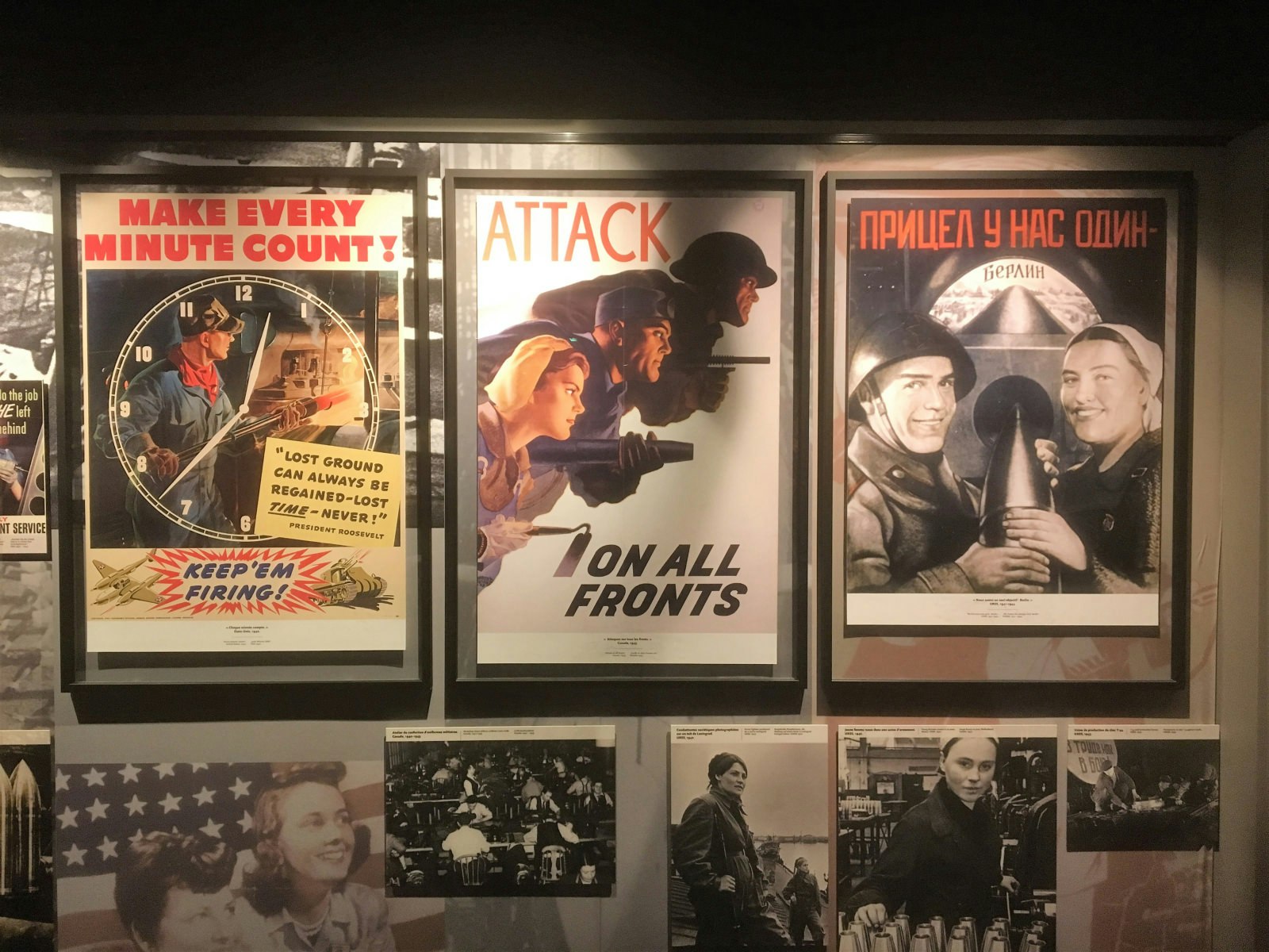 Old WWII posters show colorful, art deco visions of soldiers and manufacturers, inside the Le Mémorial de Caen, France 