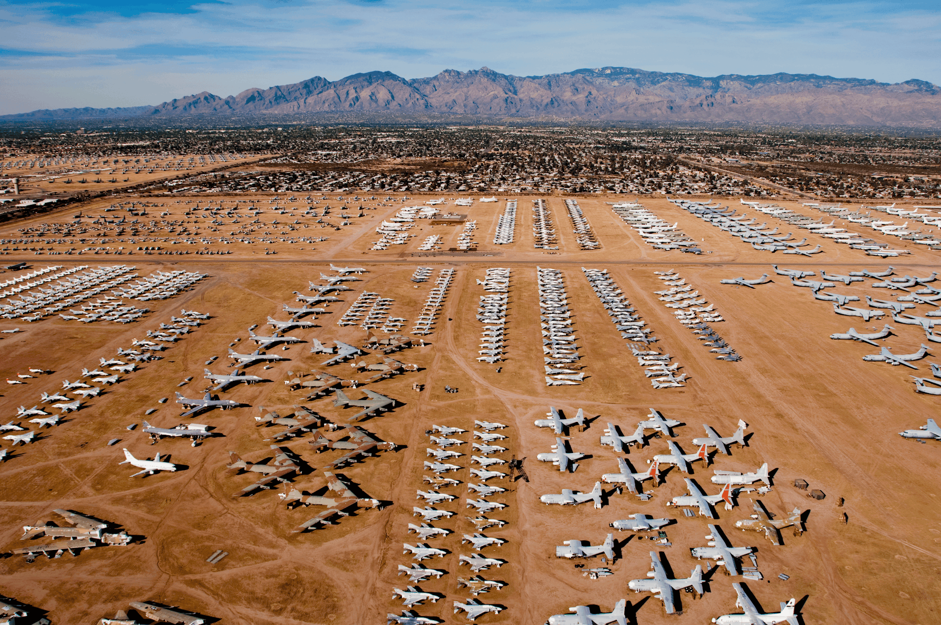 Planes are placed in formation in the desert in front of mountains © Steve Proehl / Getty Images 