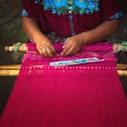 Features - mayan woman weaving on loom