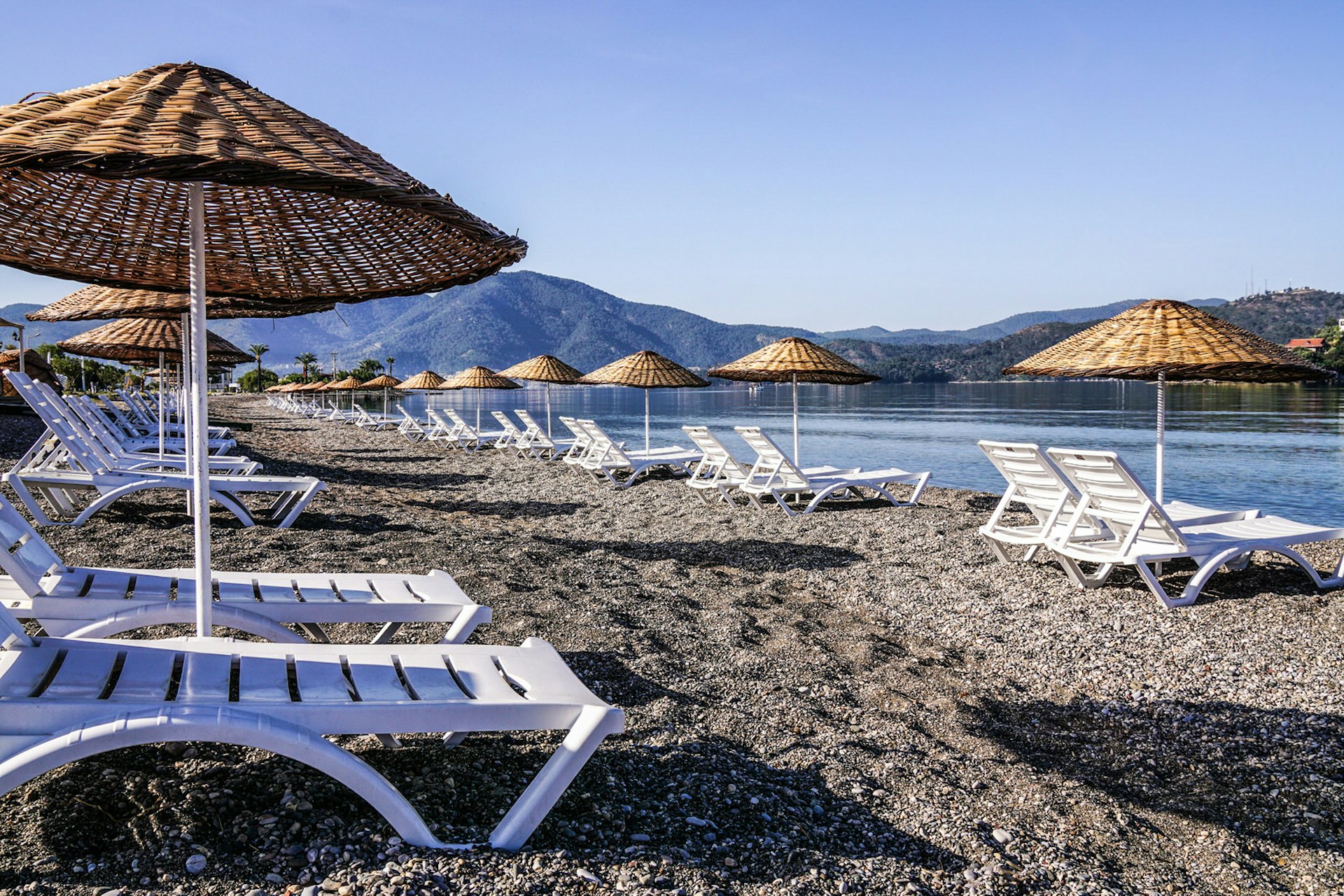Koca Çalış beach in Fethiye, Turkey, complete with sunloungers © KenanOlgun / Getty Images