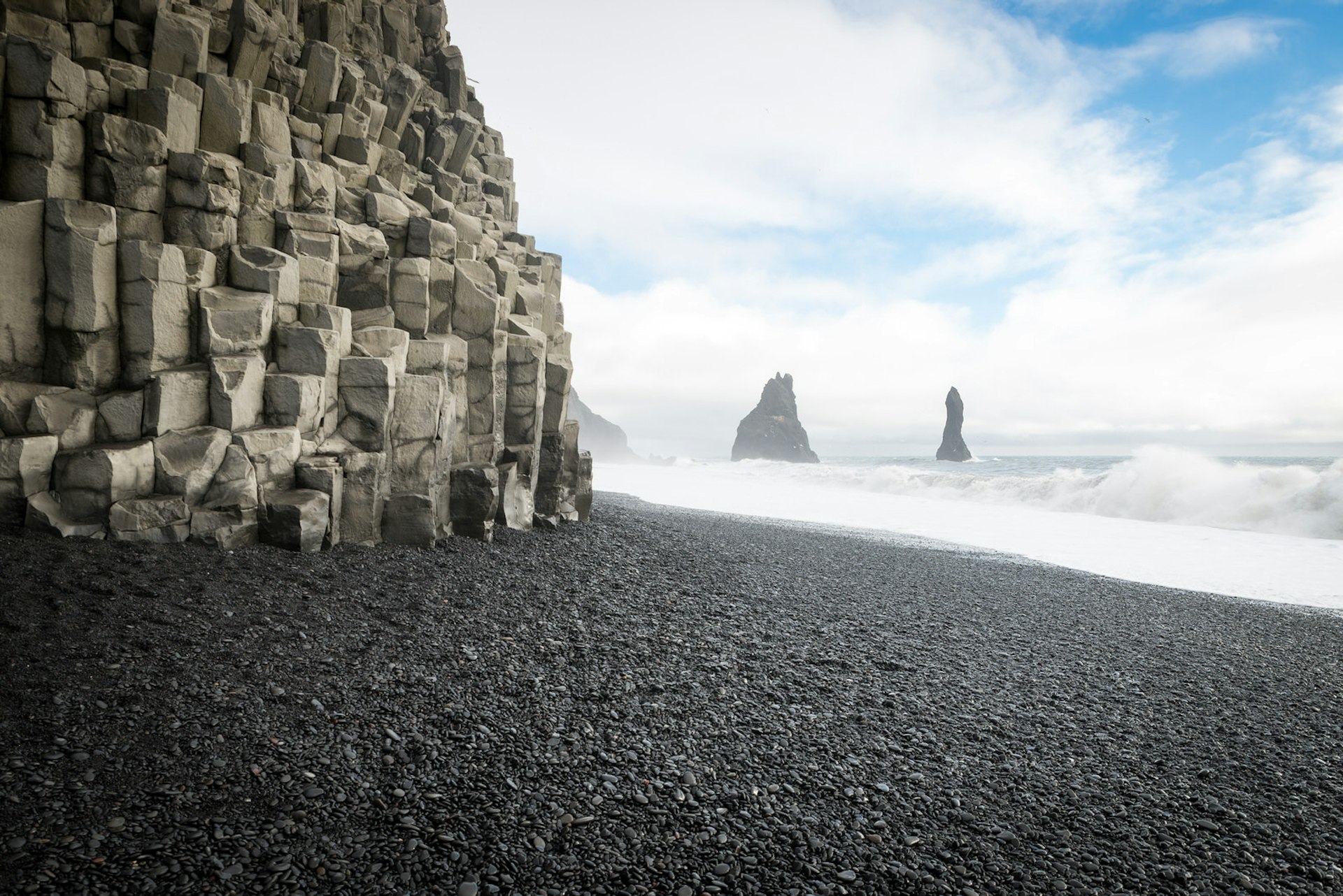 The craggy cliffs and black sand of Reynisfjara beach, Iceland © Elena Pueyo / Getty Images