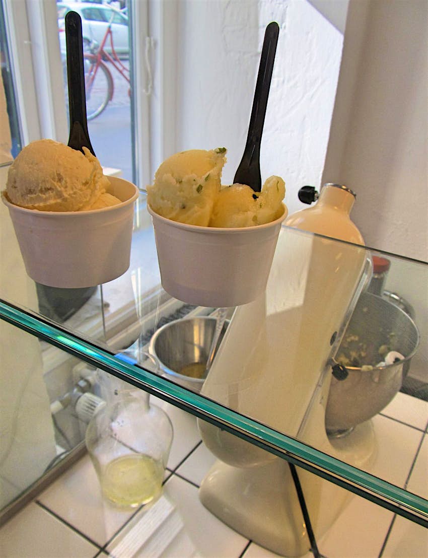 Nitrogen ice cream sitting on top of a glass counter at Istid © Caroline Hadamitzky / Lonely Planet