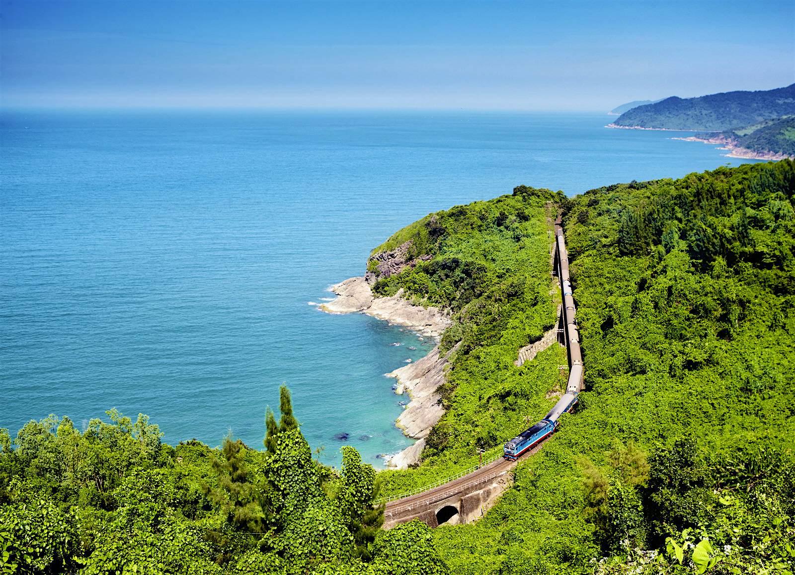 Features - LPT1017_076_1-5ded6c68b744 The Reunification Express in Vietnam rides the rails along the coast © Matt Munro / Lonely Planet