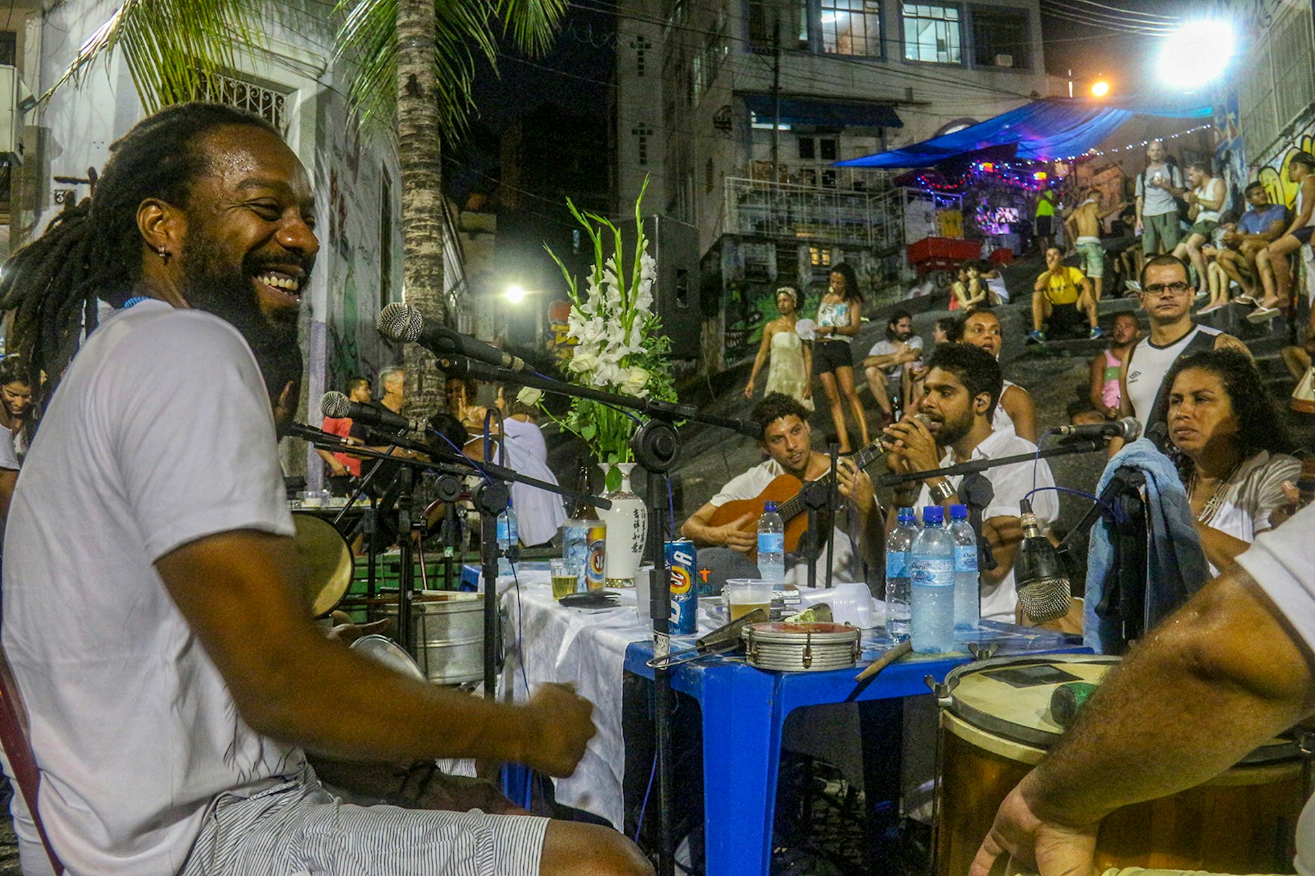 Samba musicians sit at a table of microphones in Pedra do Sul, Rio © Luiz Souza / shutterstock