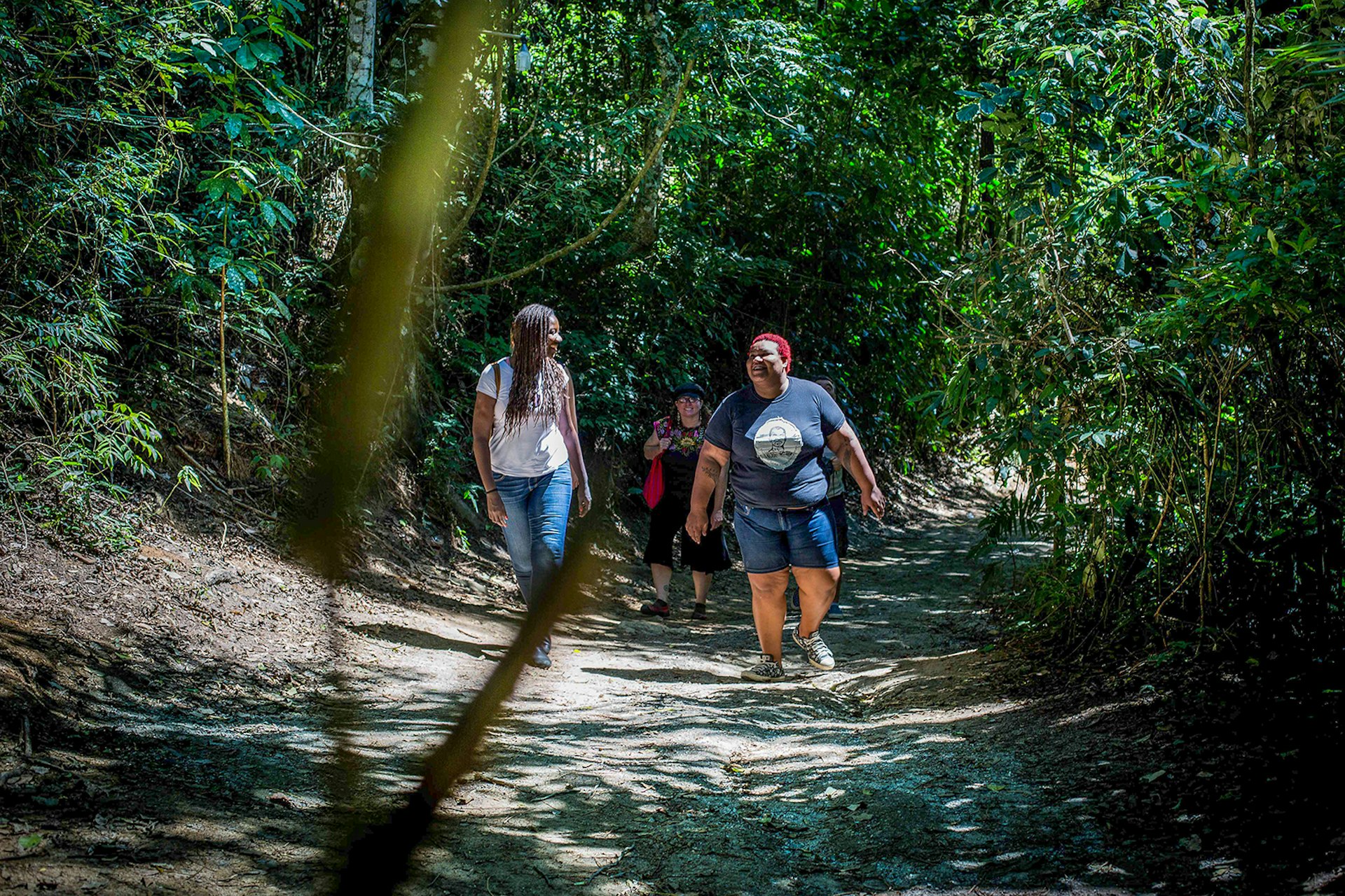 A group walks through the forest near Grotão © Kiratiana Freelon / Lonely Planet