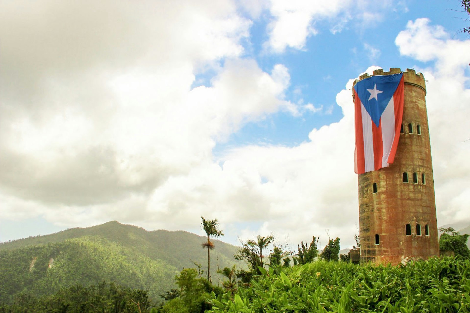 The Puerto Rican flag now proudly draped over Yokahú Observation Tower since the rainforest's reopening Mikol Hoffman / Lonely Planet 