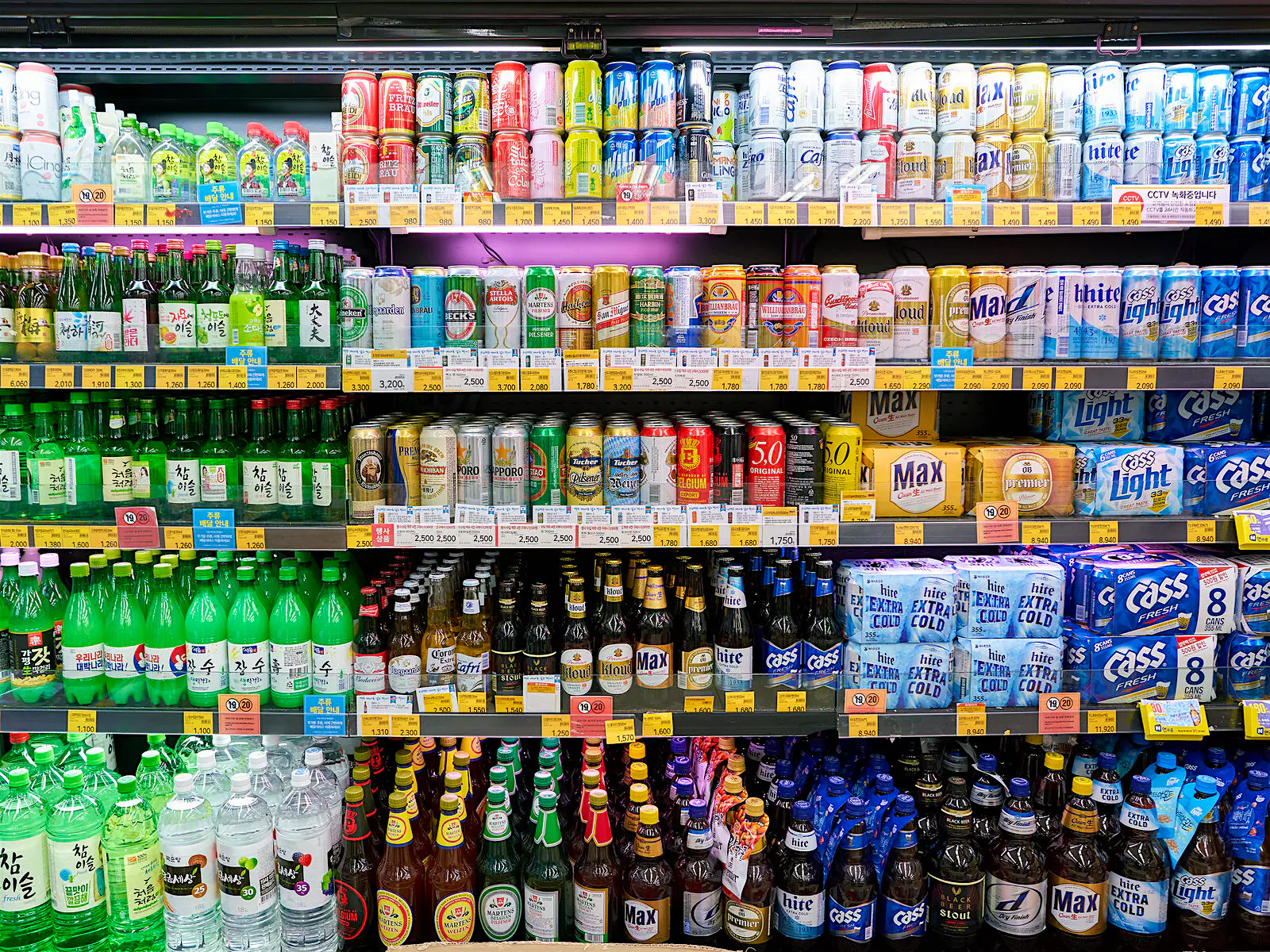 Features - Convenience stores like CU (pictured) a popular party spots and a good place to drink on the cheap © Sorbis / Shutterstock A fridge full of multi-coloured bottles of soda, beer and soju. Convenience stores like CU (pictured) a popular party spots and a good place to drink on the cheap © Sorbis / Shutterstock