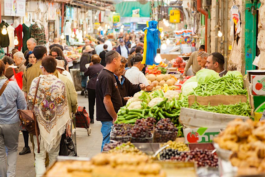 Locals and travellers shopping at Mahane Yehuda, a famous market in Jerusalem