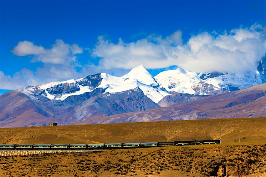 Features - shutterstockRF_140478940_1-eb3f3ebbbe51 A train passes through the Himalayas © Philip Yuan / Shutterstock