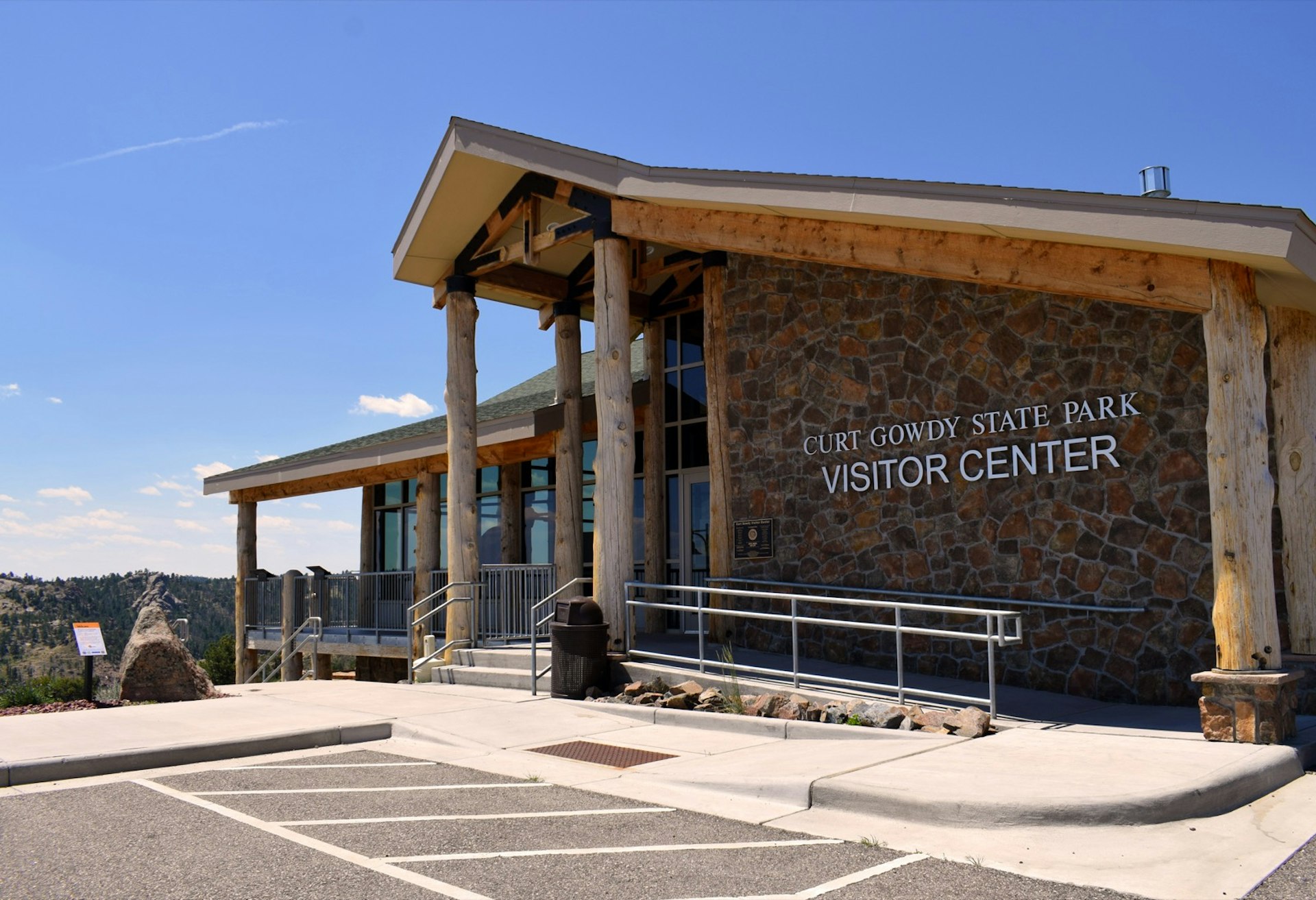 The visitor center at Curt Gowdy State Park has a facade of stacked stone with columns made from single stripped trees in Cheyenne, Wyoming © Dave Parfitt / Lonely Planet