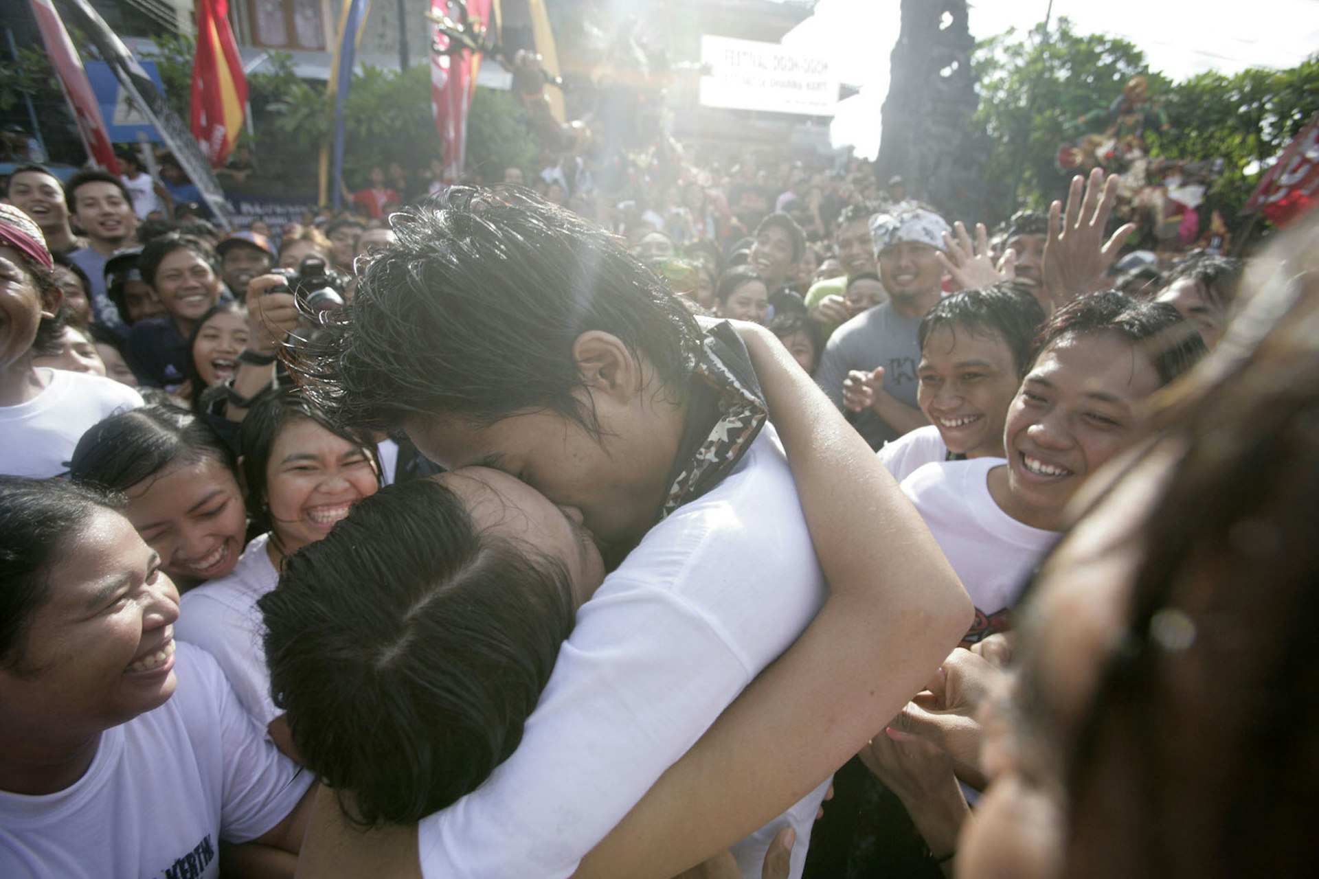 A young Balinese couple kiss during the Kissing Festival held in Sesetan village, Bali, Indonesia