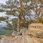 Rock sign saying 'Bald Rock' at a viewpoint over much of Northeast Alabama, near the top of Mt Cheaha