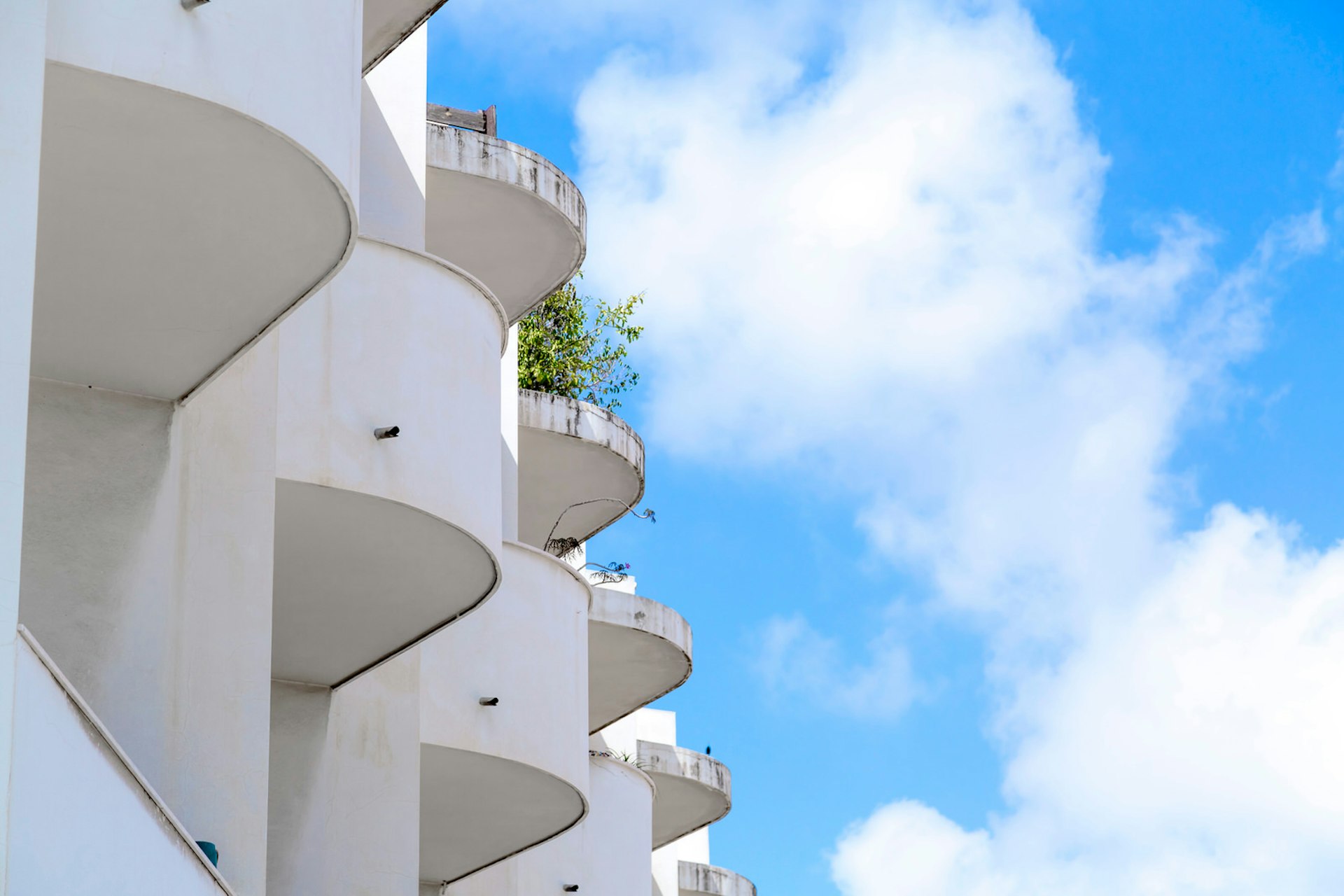 A white Bauhaus building in Tel Aviv with sinuous balconies.