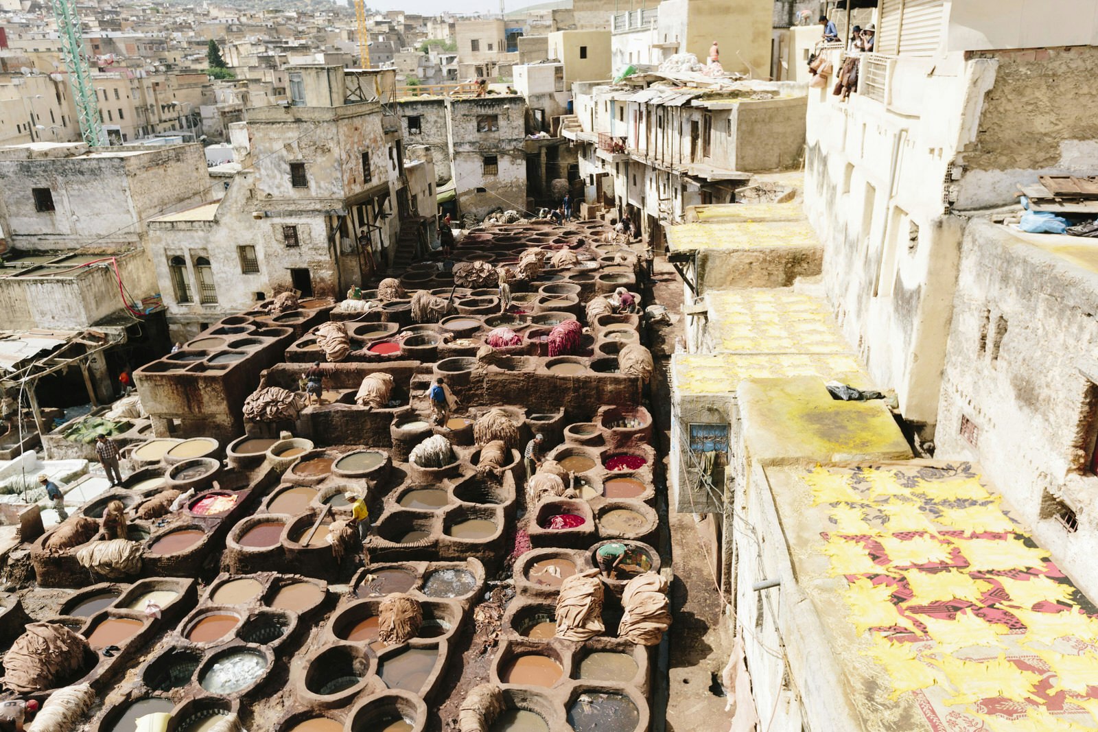 View of workers at the Chaouwara Tanneries in Fez, Morocco