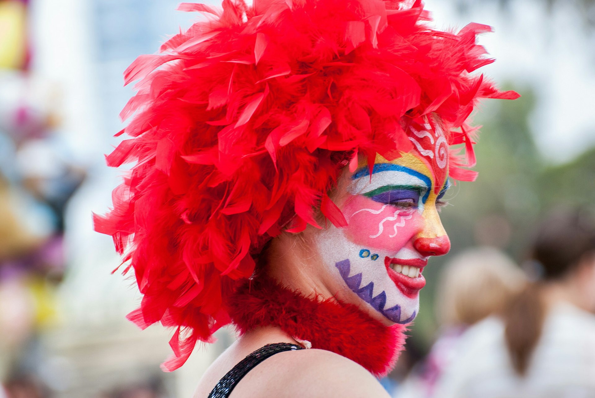 Woman dressed up in face paint and a wig for the Jewish festival of Purim in Tel Aviv.