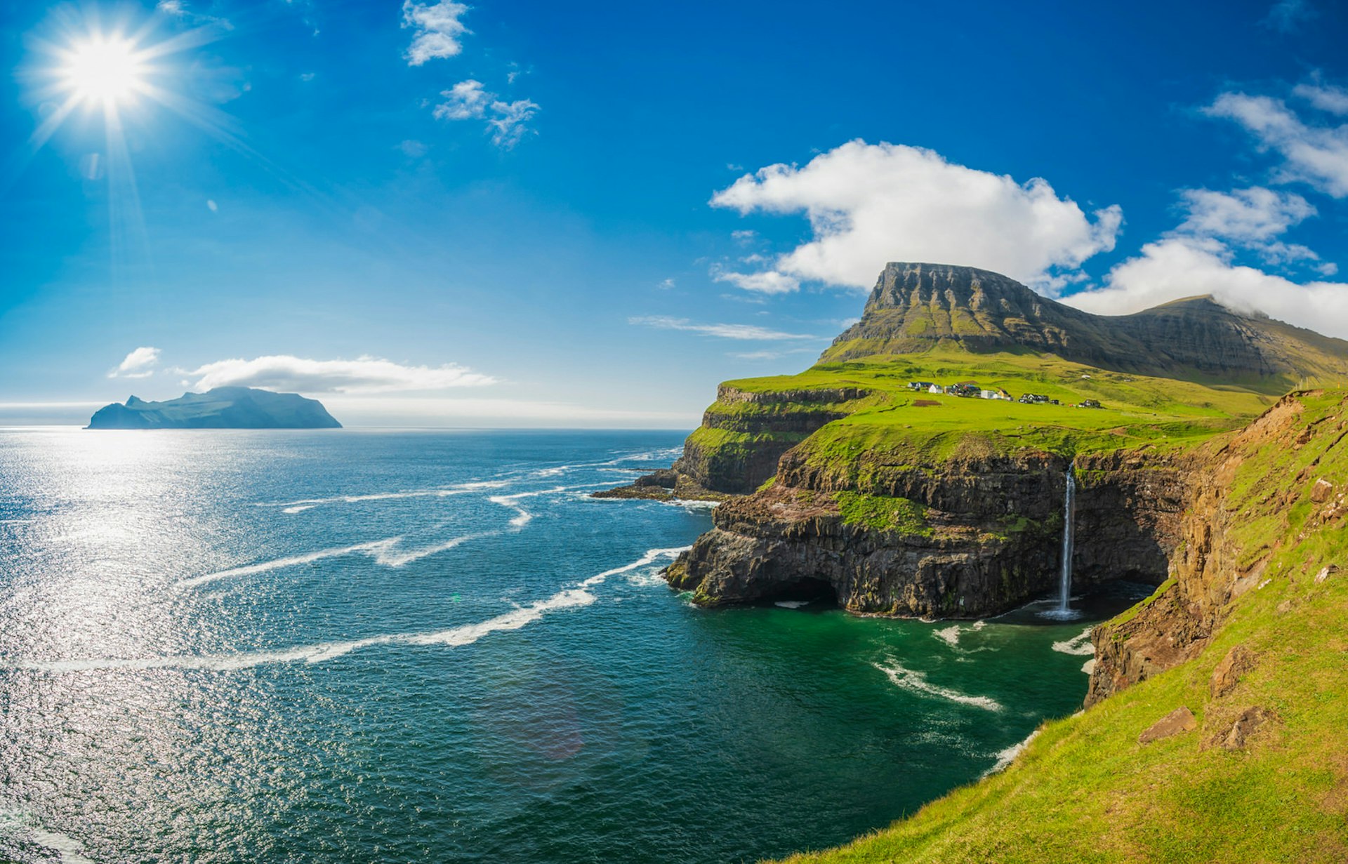 Múlafossur Waterfall, Faroe Islands on a sunny day.