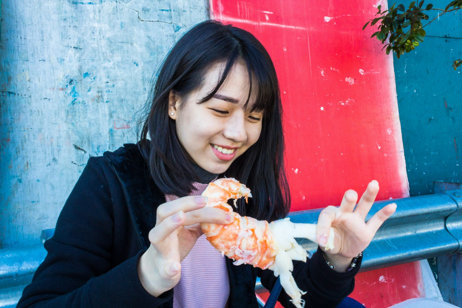 A woman eats seafood in Sydney