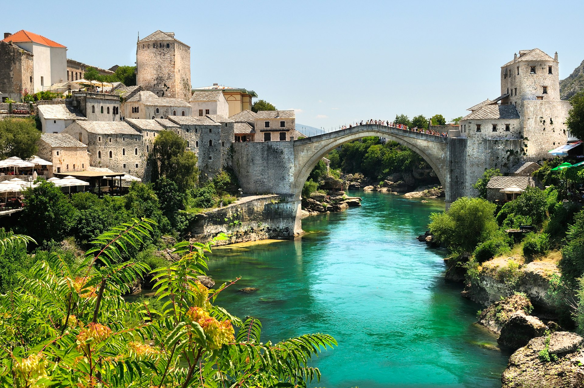 The elegant arch of Stari Bridge spans the turquoise waters of the river Neretva