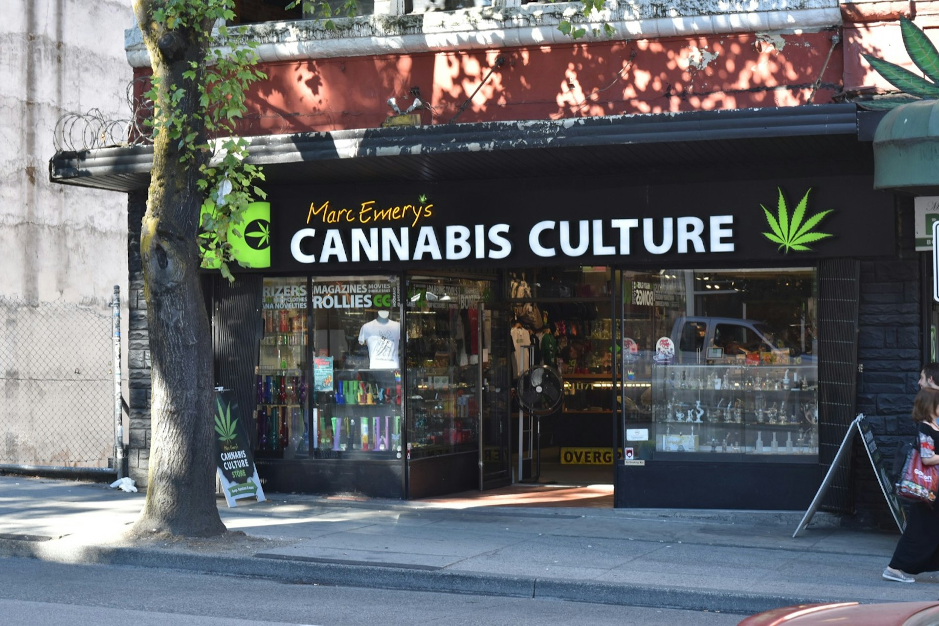 A shop with a black awning and large windows filled with cannabis-smoking paraphernalia in Canada, where you can now legally purchase pot