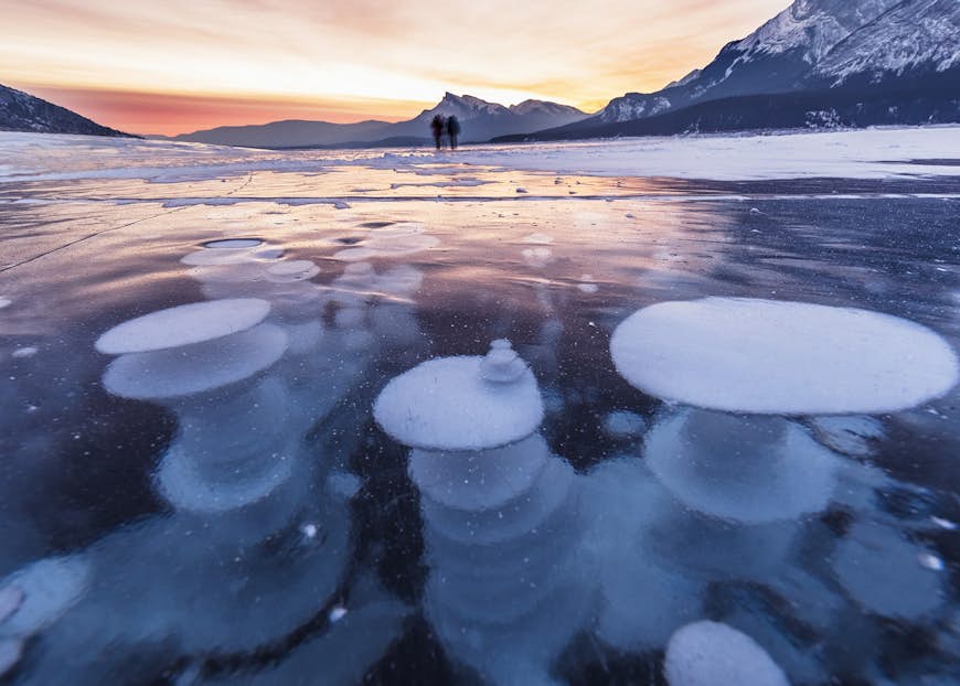 Bubbles trapped in the frozen water of Abraham Lake, Canada