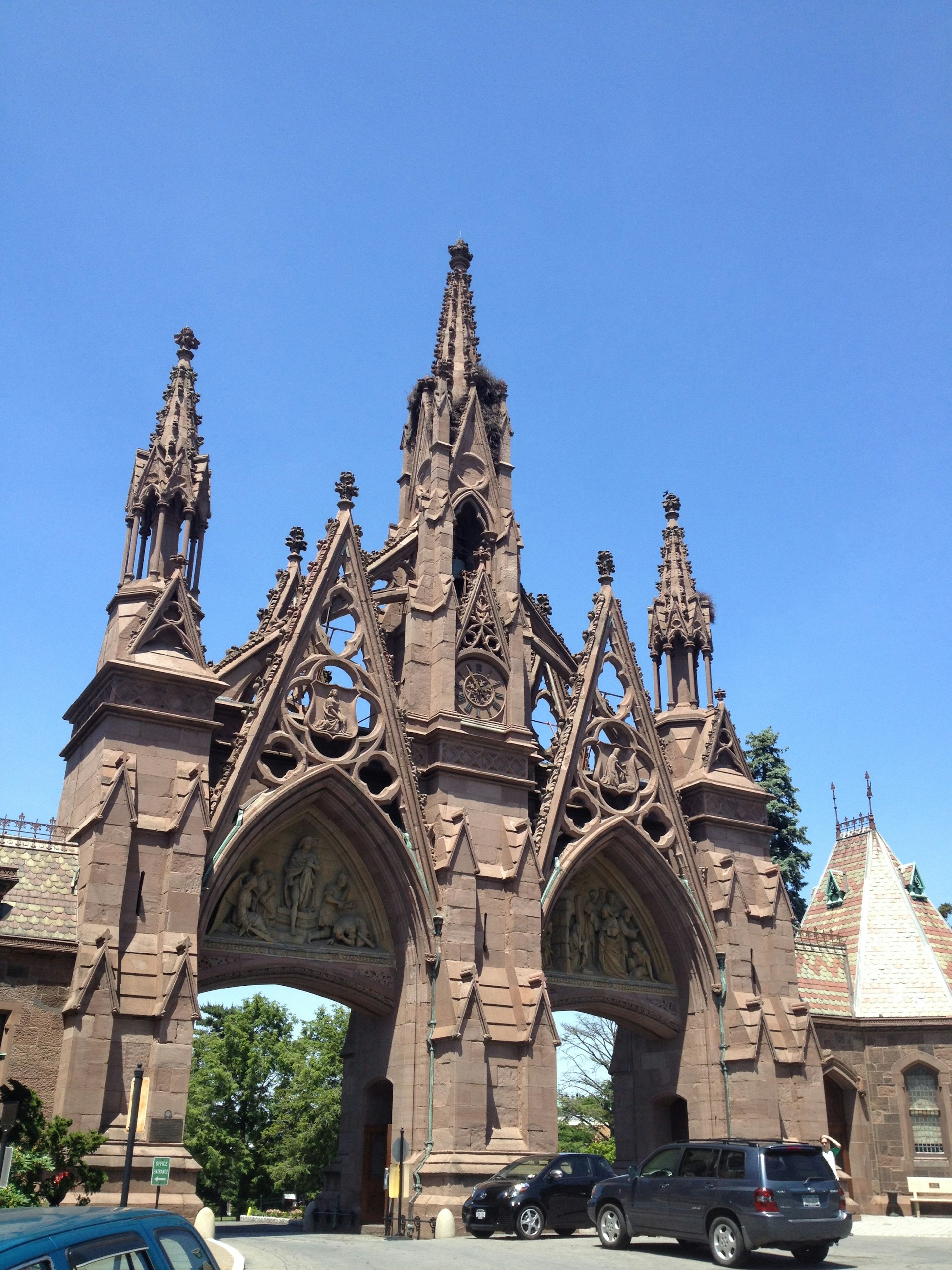 Highly ornate, Gothic-style gateway, with two separate arches to drive under