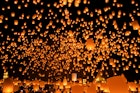 Bright lanterns light the sky in Chiang Mai for Loi Krathong