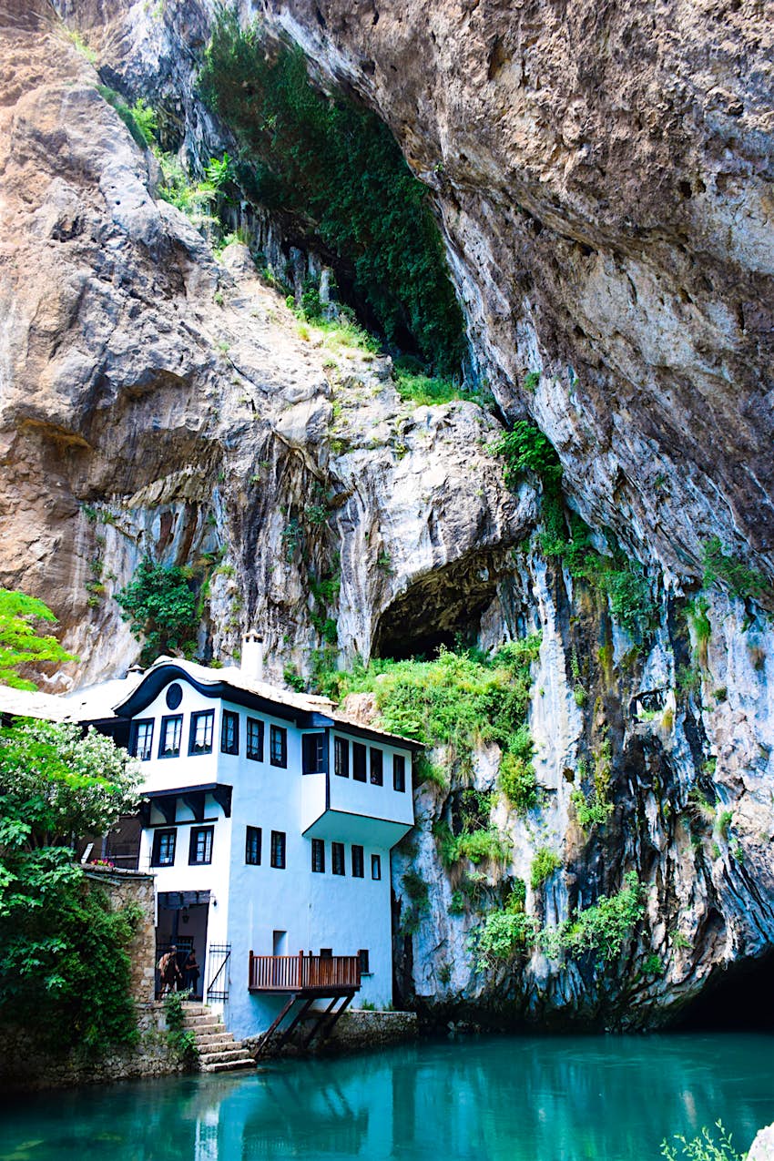 Features - Blagaj Tekke The Blagaj Tekija sits by the River Buna, overshadowed by precipitous cliffs