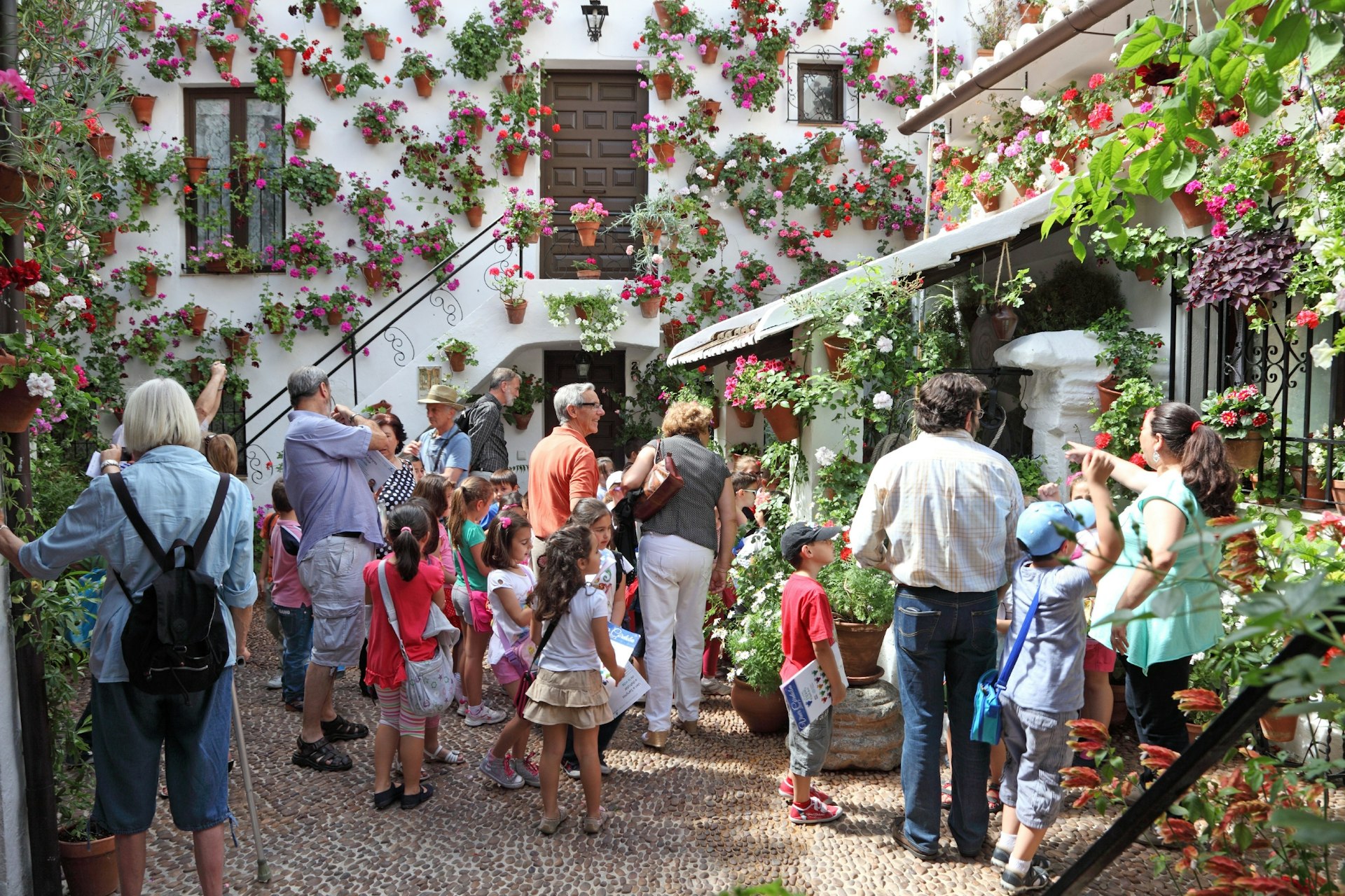 A flower-lined inner courtyard during the Fiesta de los Patios de Córdoba 