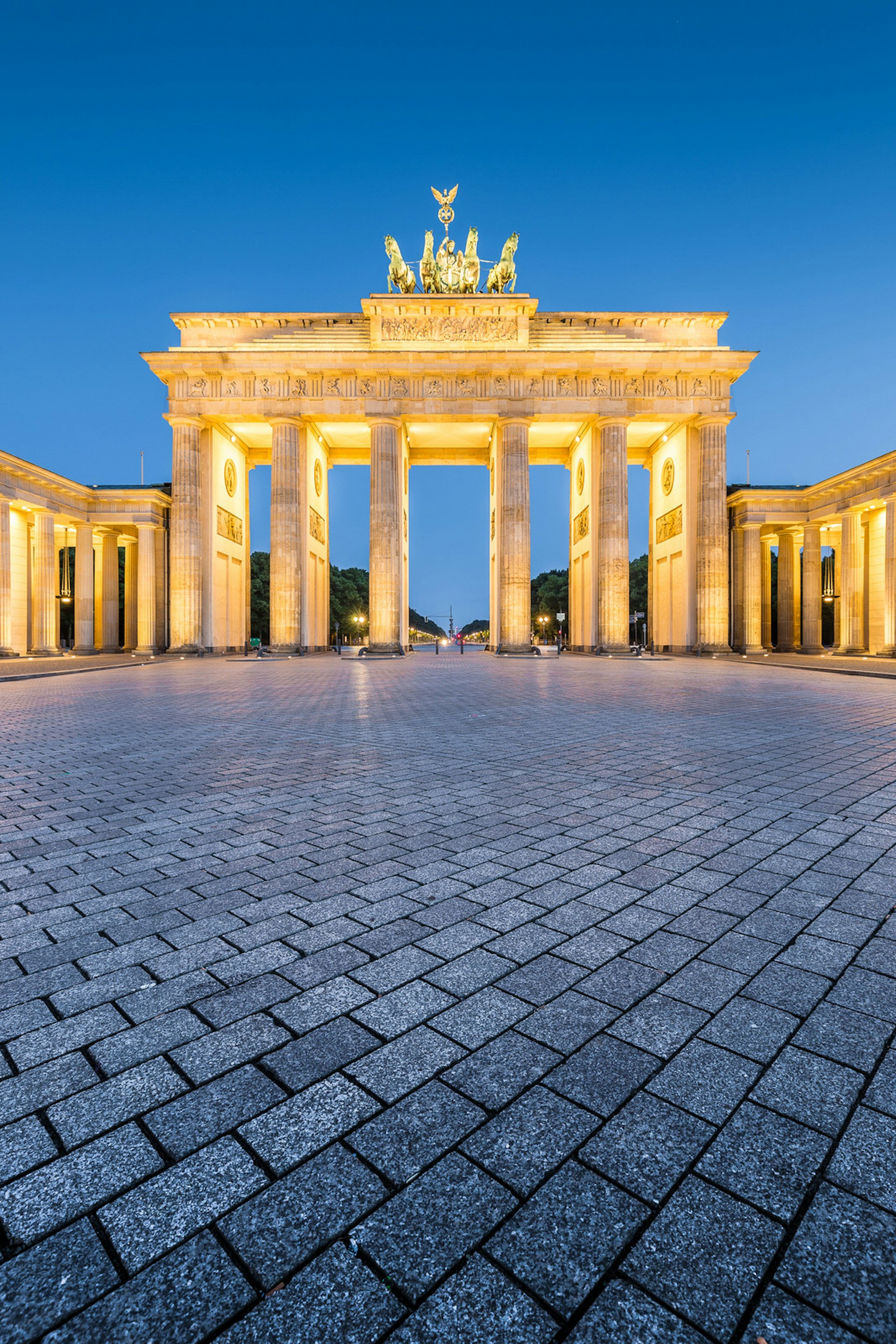 Free Berlin - Classic vertical view of historic Brandenburg Gate, Germany's most famous landmark and a national symbol, in post sunset twilight during blue hour at dusk in summer, central Berlin, Germany