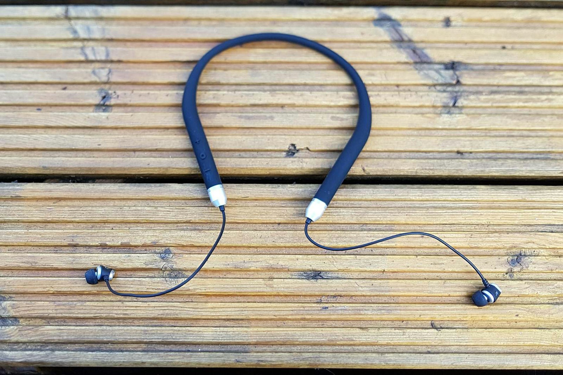 Kinetic Neckband Earphones from Kitsound, shown with black 'band' that rests on the back of the neck