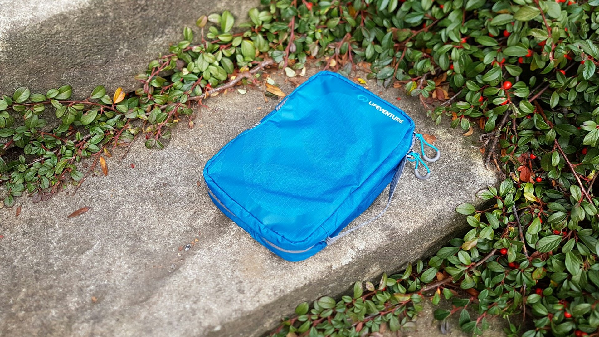 Lifeventure Travel Washbag, shown in blue with a grey handle