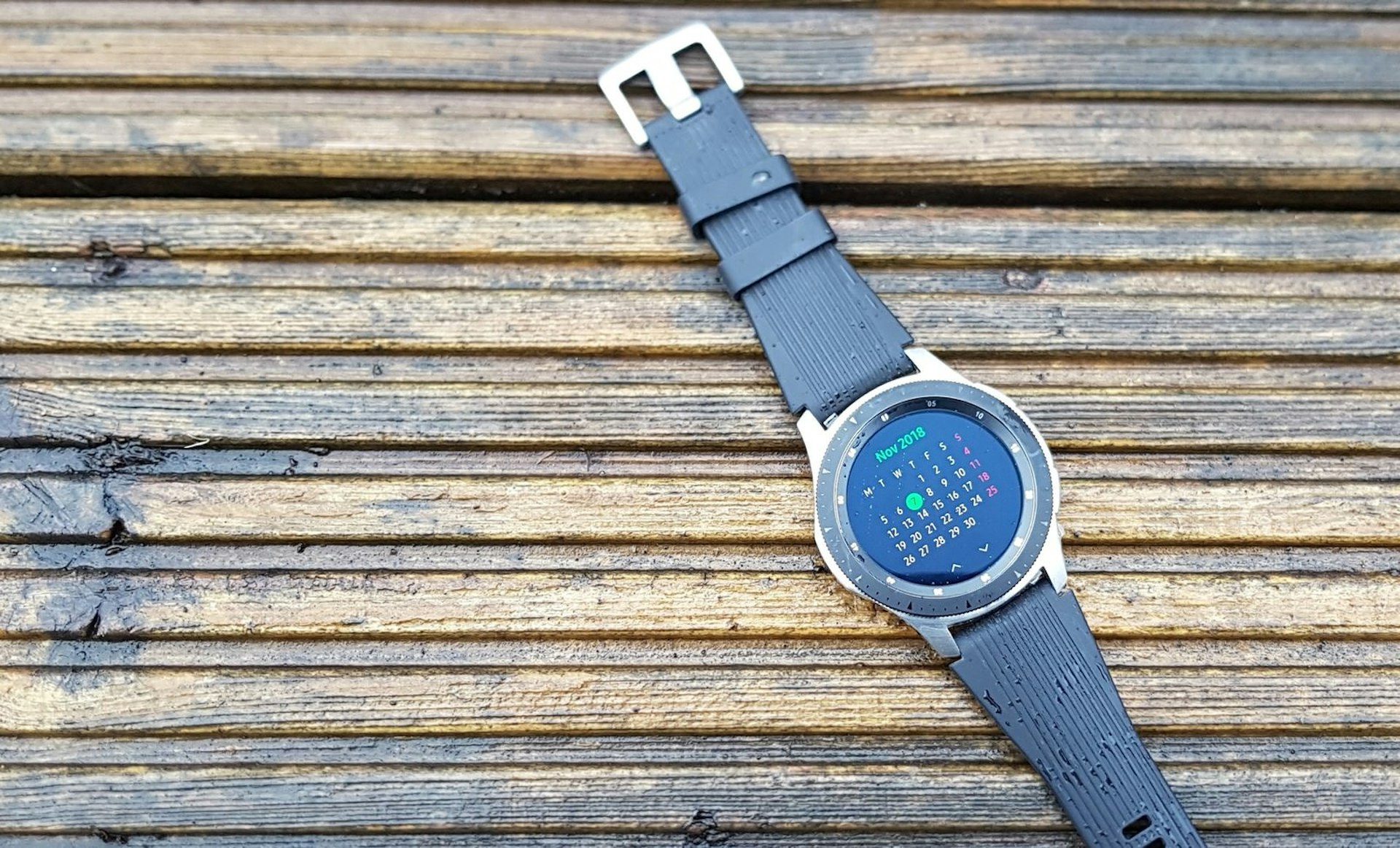 The Samsung Galaxy Watch, shown with a calendar displayed on the face and black strap