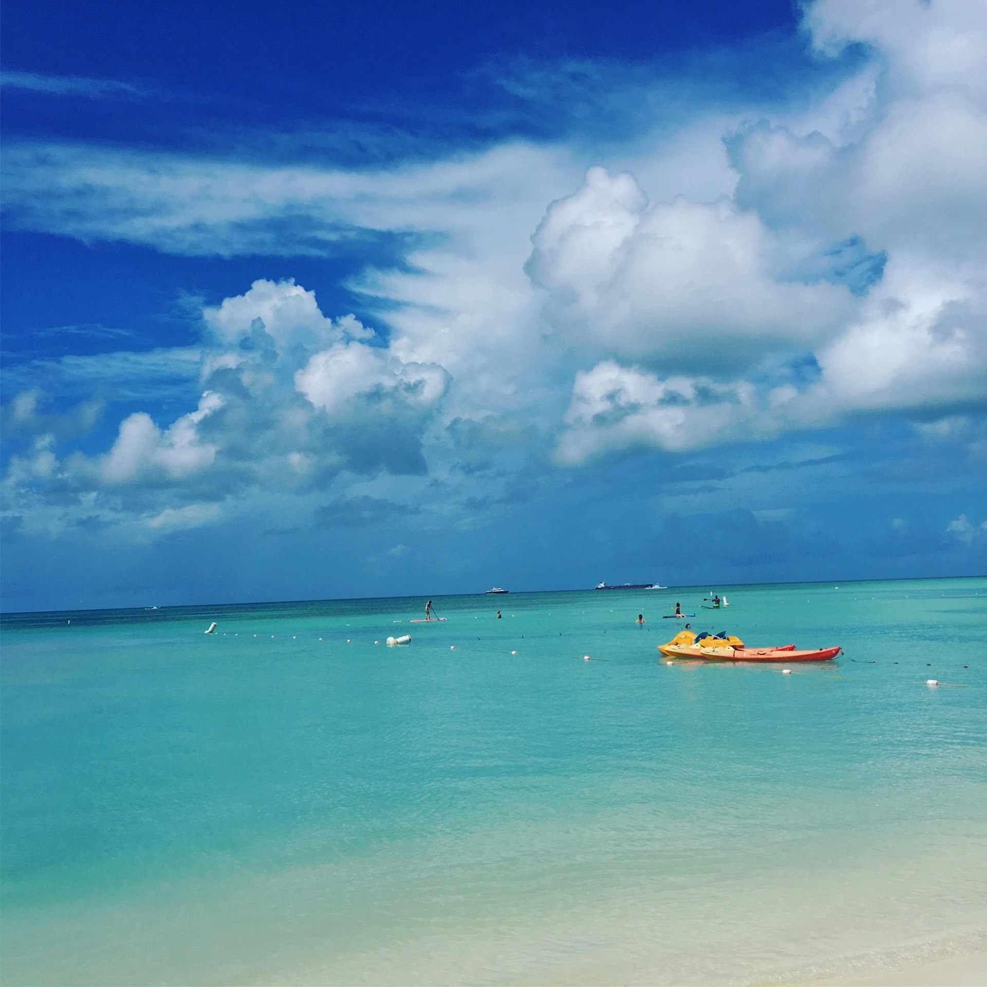 A yellow kayak floats in the clear waters at Eagle Beach in Aruba © Alicia Johnson/Lonely Planet 