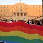 A huge rainbow flag in front of the Greek Parliament during the annual Pride parade © Kostas Koutsaftikis / Shutterstock