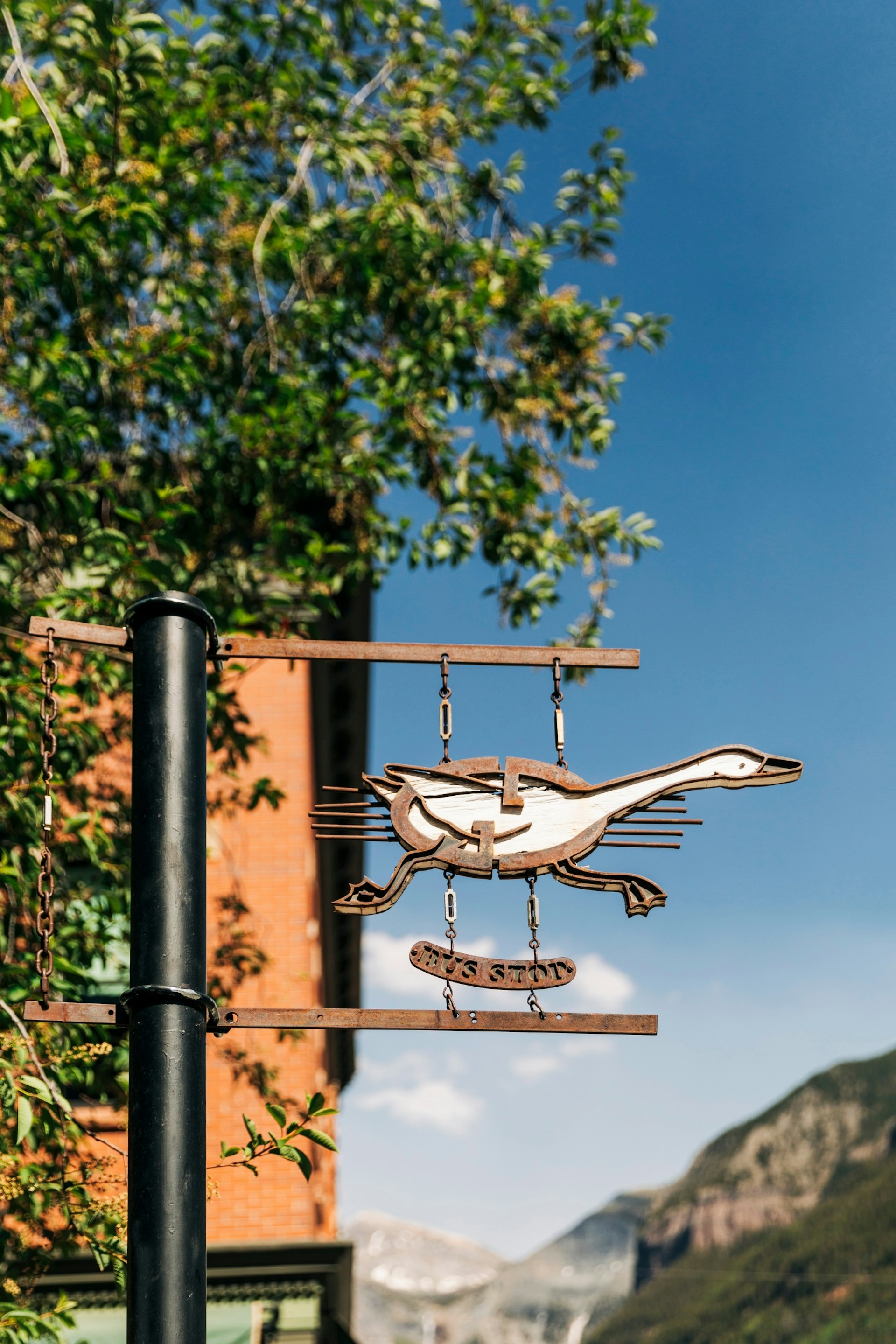 A goose-shaped bus stop sign in Telluride