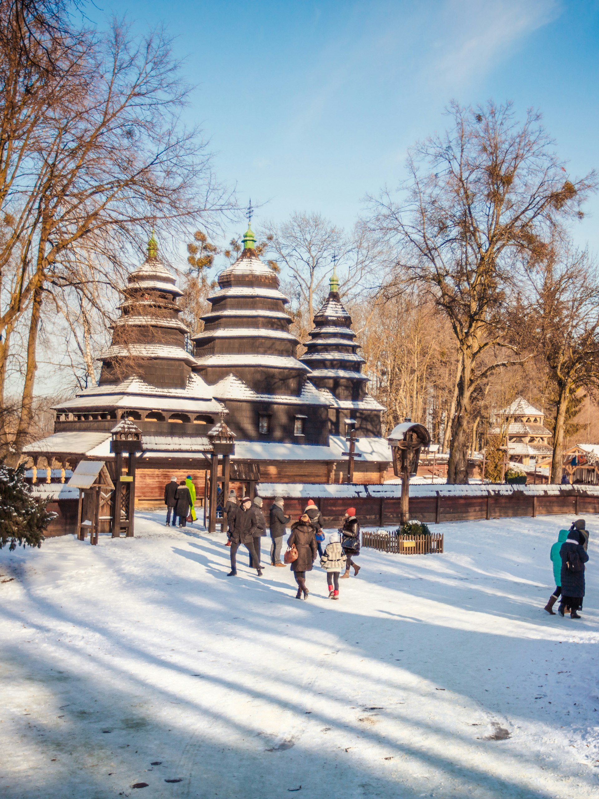 An old wooden church in Lviv's Museum of Folk Architecture and Life under the snow © Ruslan Lytvyn / Shutterstock