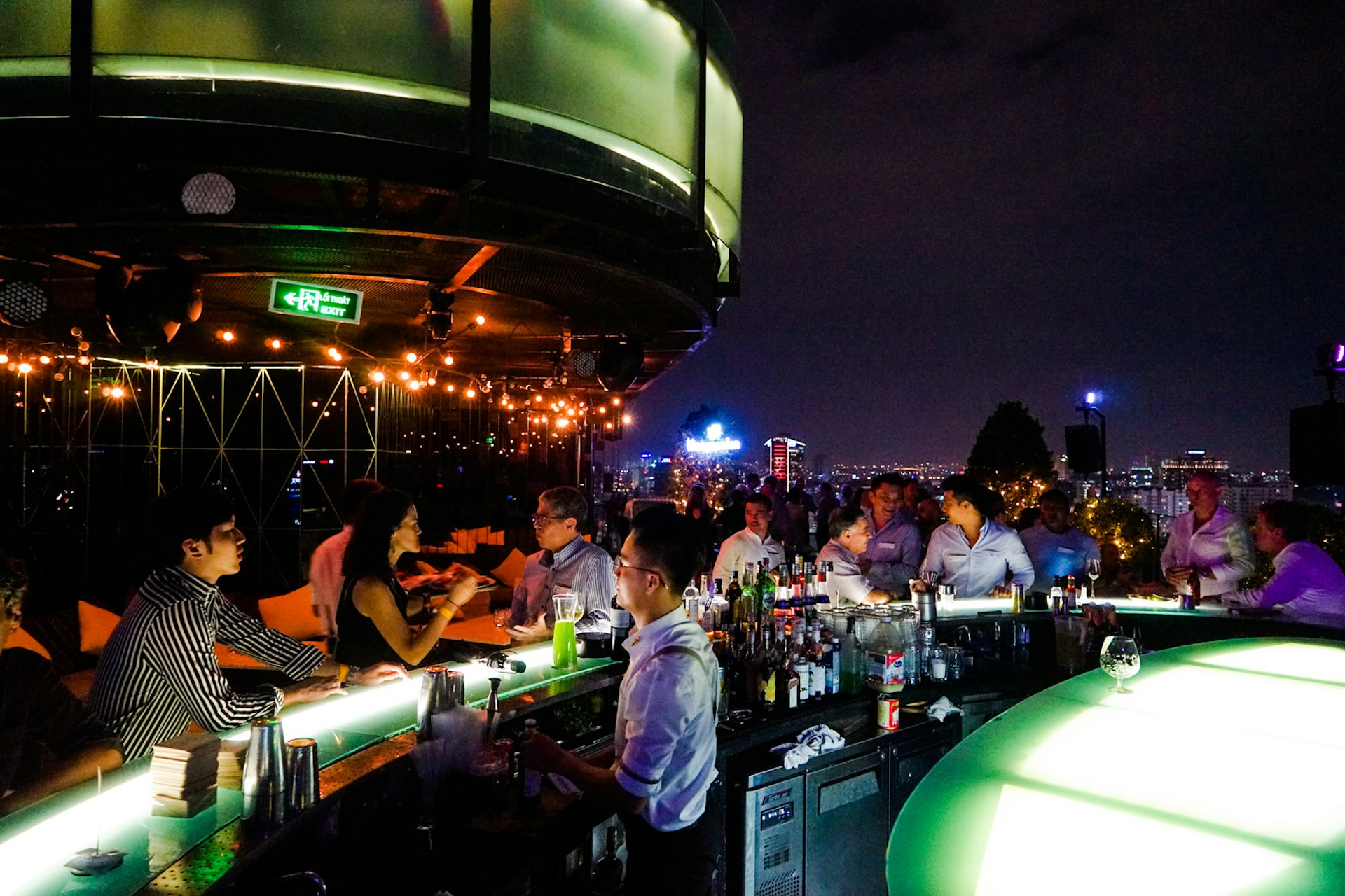 People relax under the night sky at Air 360