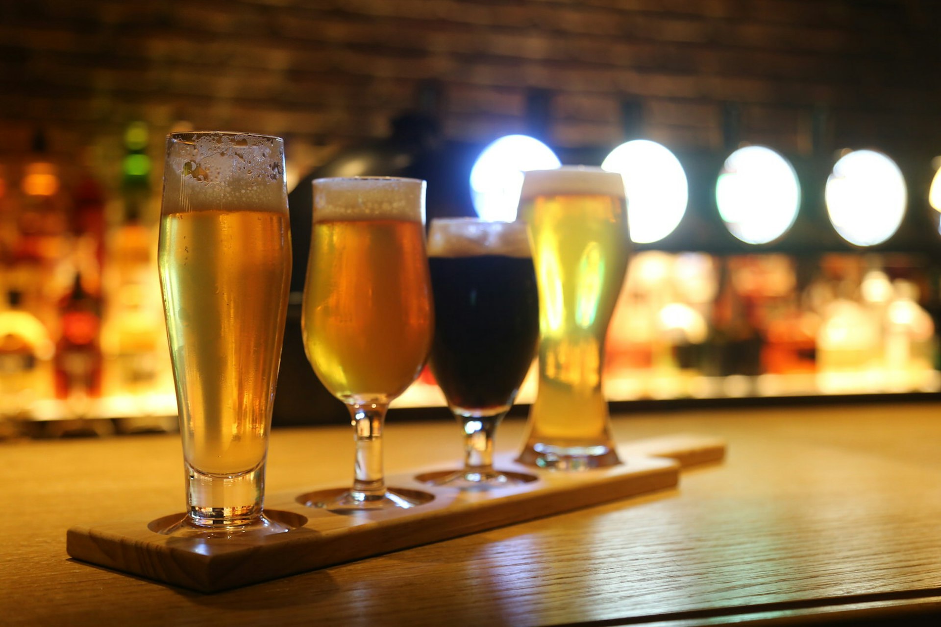 Four glasses of craft beer in a bar at Backroom in Beirut, Lebanon