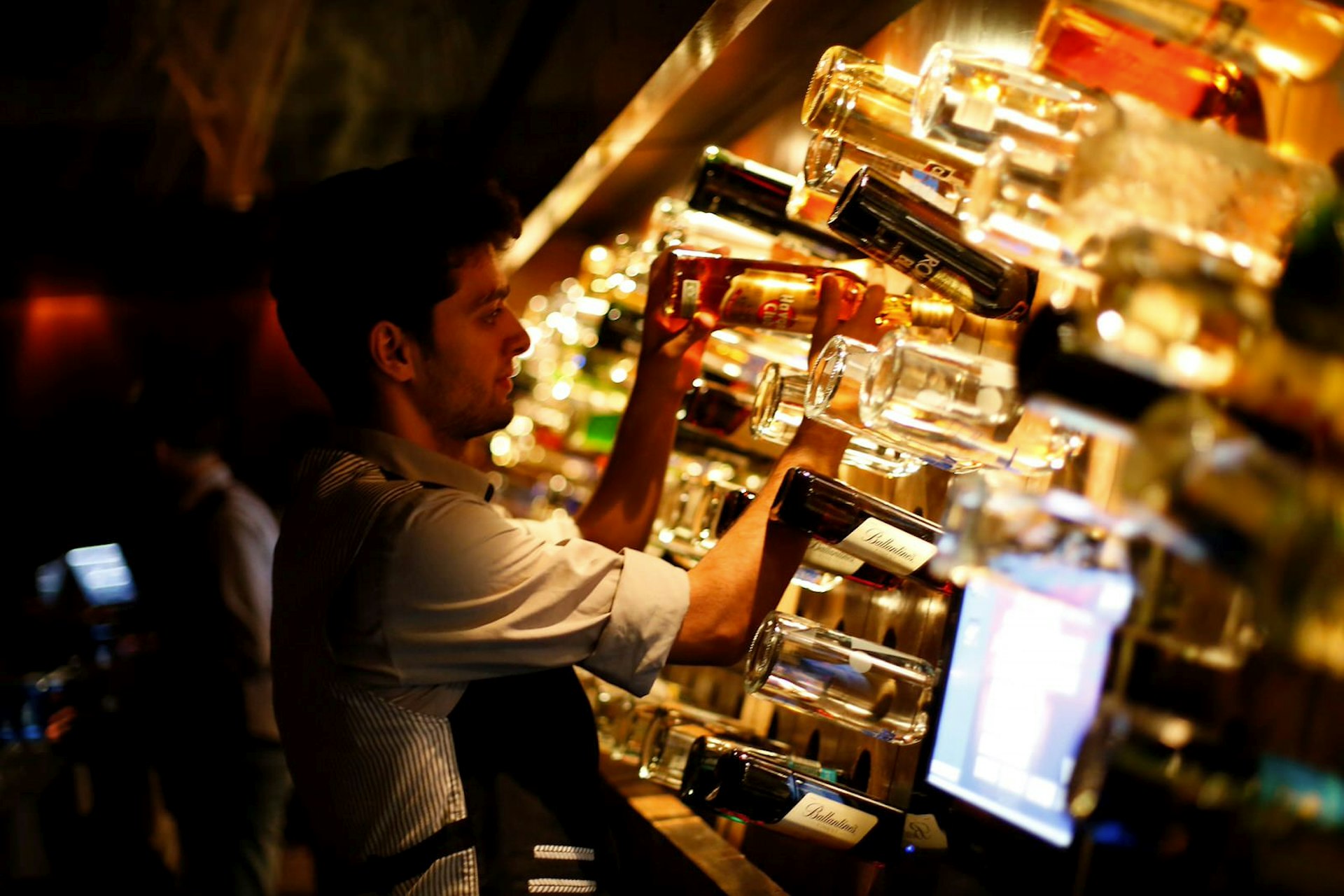 A man tends to the bar at a nightclub in Beirut, Lebanon