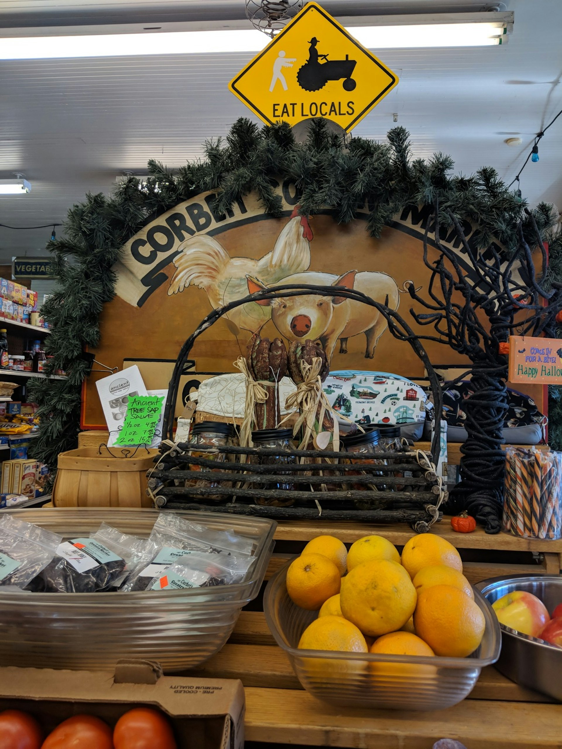 Packages of jerky and fresh fruits are arranged in a display at a one of Oregon's country stores