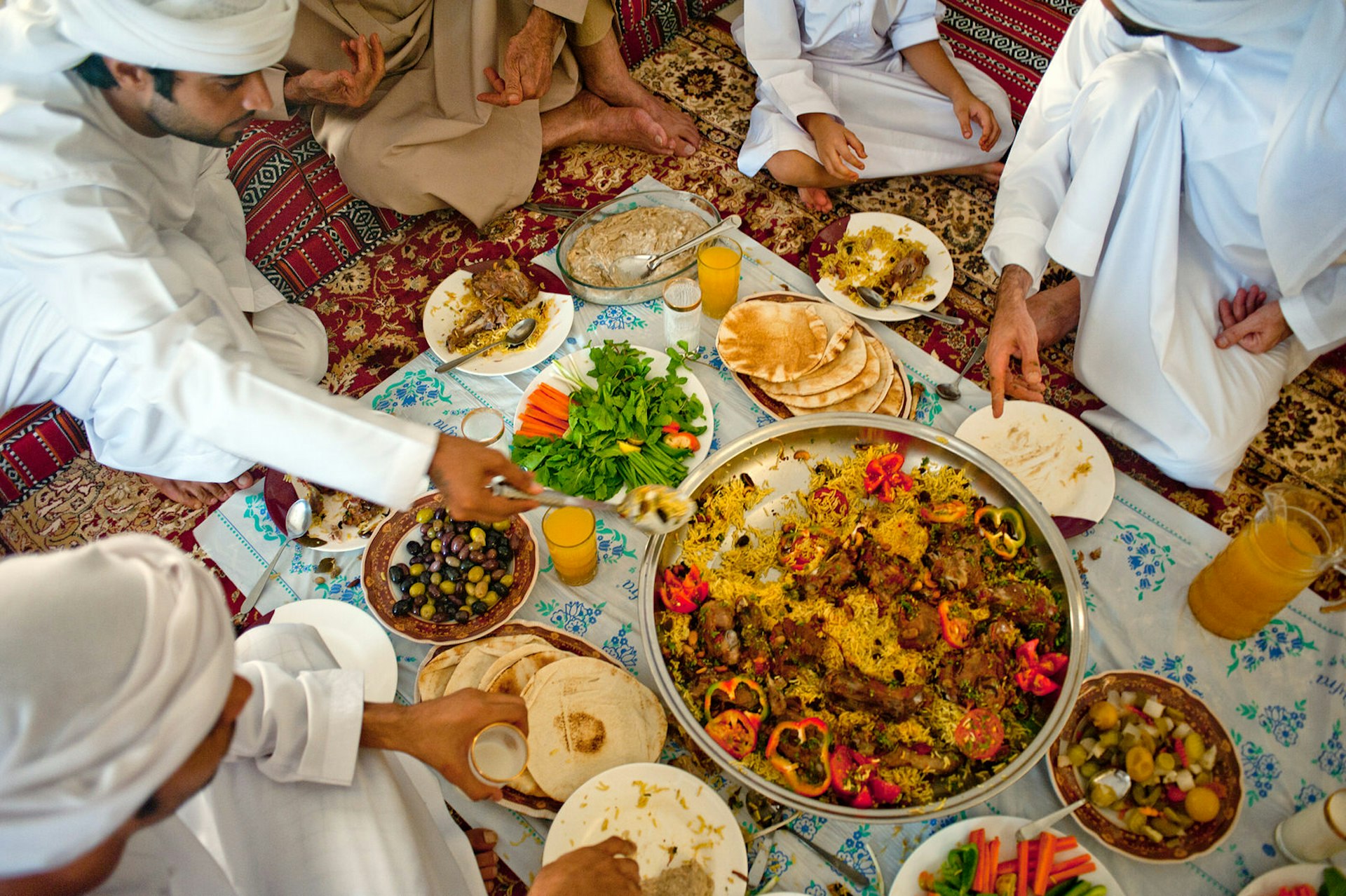 An Emirati family eat together to break the fast during Ramadan, Dubai, United Arab Emirates
