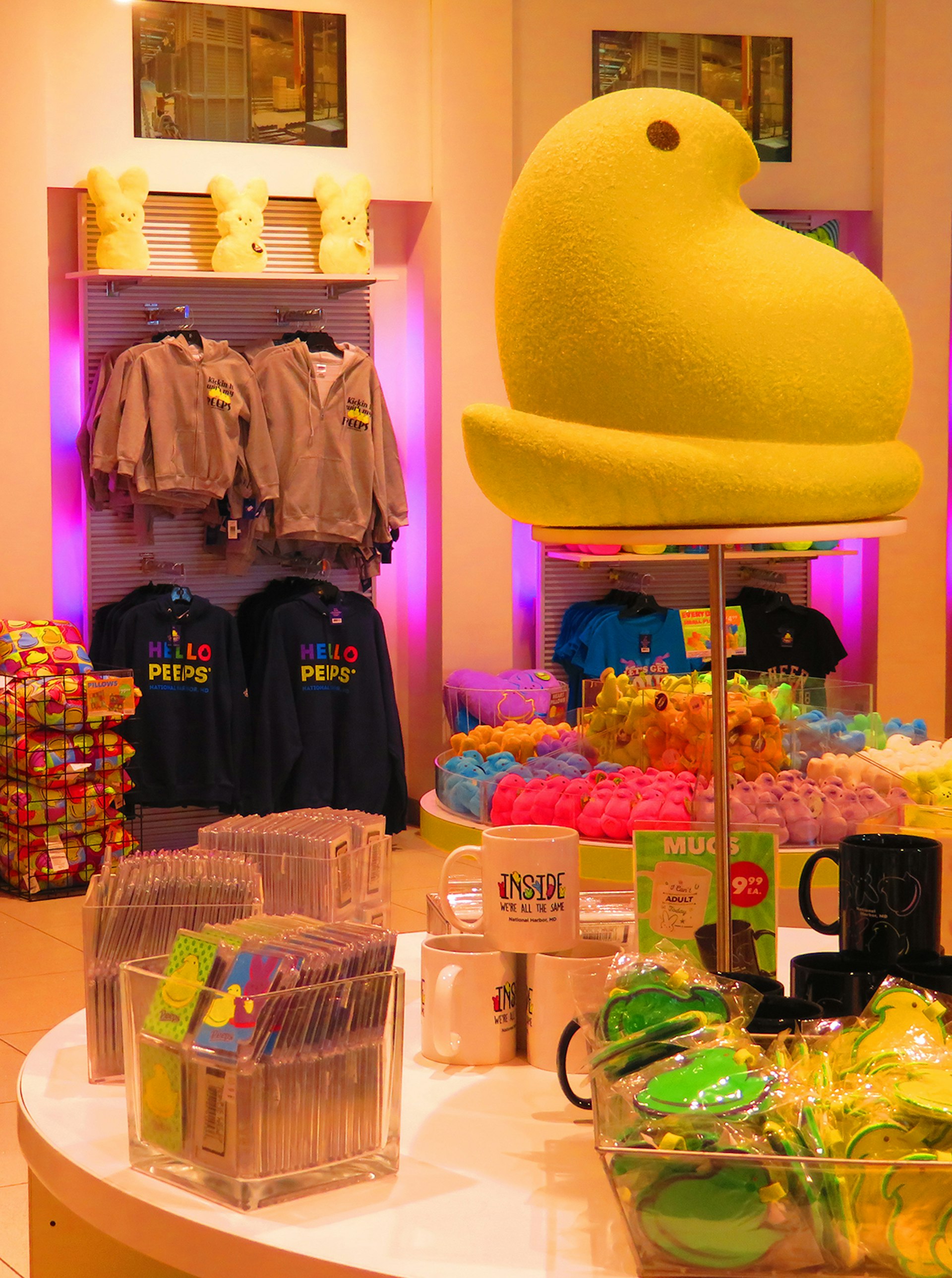Large yellow Peep chick sits atop a display of mugs and other goods that feature the iconic marshmallow candies, in a store dedicated to Peeps merchandise