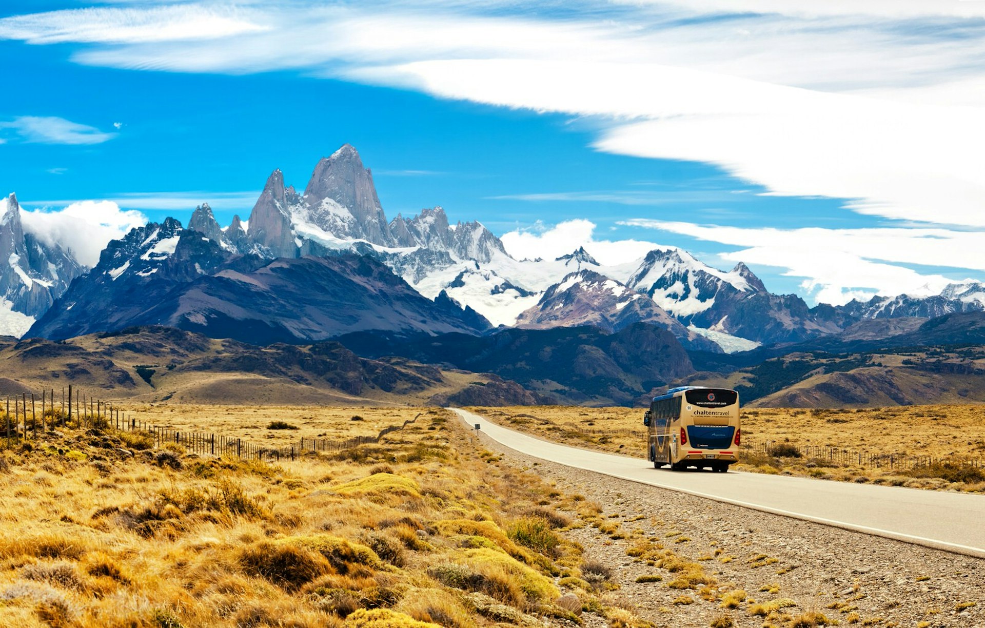 A bus travelling to El Chalten in Argentina, with the mountainous Patagonian Ice Field in the background